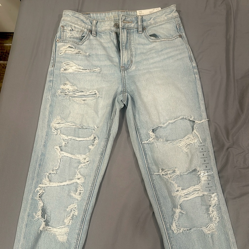 Never worn, tags still on American Eagle Jeans. Size 2 mom jeans.